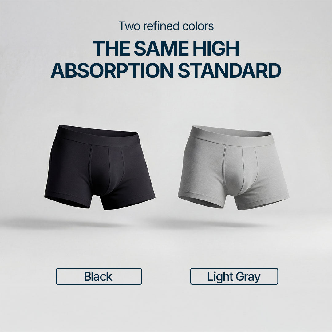 Two absorbent boxer briefs for light bladder leaks in black and light gray, offering the same high level of absorption and comfort, washable and discreet underwear for mild male incontinence, available in two elegant color options.
