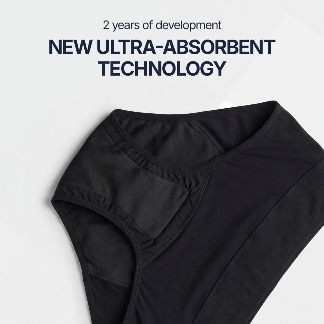 Close-up detail of black absorbent underwear for female incontinence, featuring new ultra-absorbent technology developed over 2 years, enhanced multi-layer protection designed for light to moderate bladder leaks.