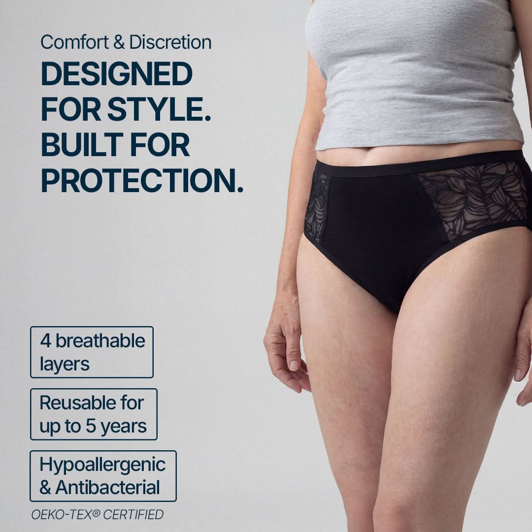 Woman wearing black absorbent underwear with elegant side lace for female incontinence, featuring 4 breathable layers, reusable for up to 5 years, hypoallergenic and antibacterial, OEKO-TEX certified, providing comfortable and discreet protection for light to moderate bladder leaks.