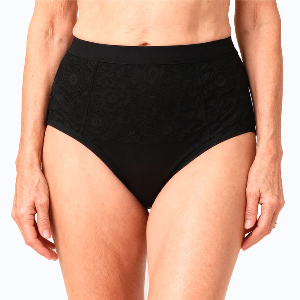 Woman wearing high-waisted black absorbent underwear for female incontinence, ultra-absorbent and washable design, discreet and elegant solution for light to moderate bladder leaks, offering comfortable support and reliable everyday protection.