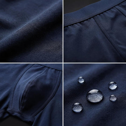 Close-up of navy blue Orykas men's incontinence boxer briefs showcasing bamboo fiber patchwork and reinforced multi-layer absorption zone for superior leak protection