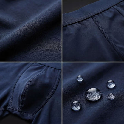 Close-up of navy blue Orykas men's incontinence boxer briefs highlighting patchwork bamboo fiber absorption zone with discreet leak protection