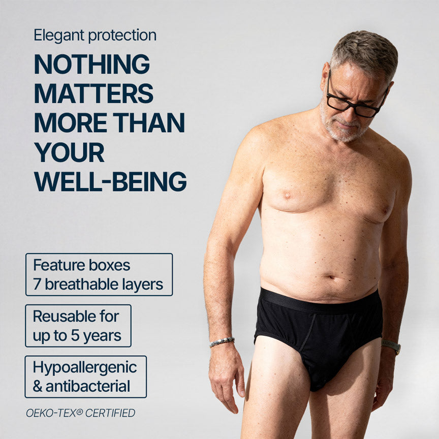 Adult man wearing black Orykas absorbent briefs against a neutral background, highlighting elegant incontinence protection with 7 breathable layers, reusable for several years, hypoallergenic and antibacterial, OEKO-TEX® certified for safe and skin-friendly comfort.